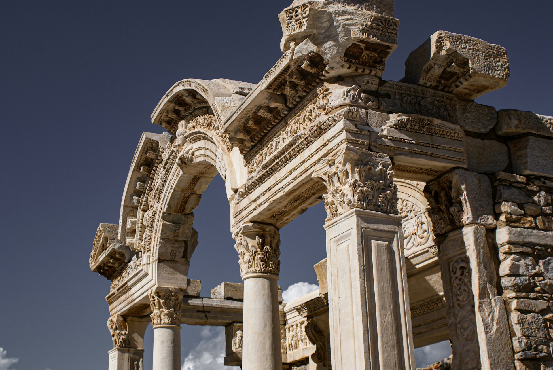 a large stone structure with columns and arches